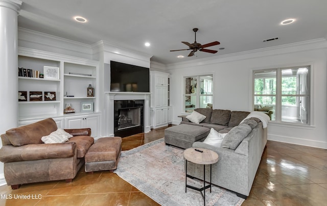 1025 Monet Cv, Brandon, MS 39047 - tiled living area featuring crown molding, a ceiling fan, a fireplace, recessed lighting, and baseboards