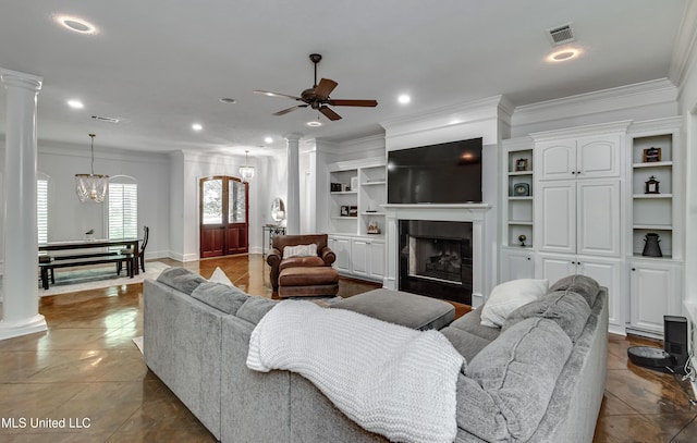 1025 Monet Cv, Brandon, MS 39047 - living room featuring decorative columns, ornamental molding, a ceiling fan, a fireplace, and recessed lighting