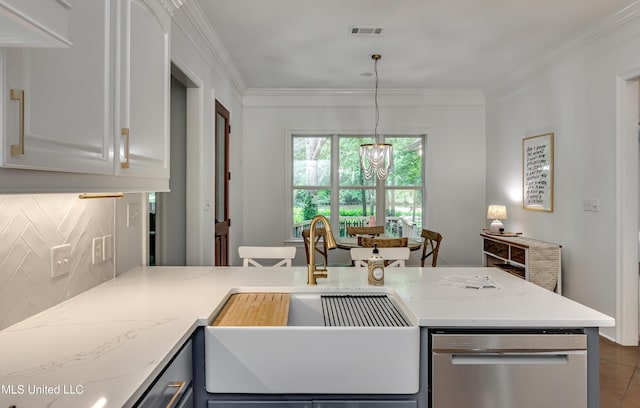 1025 Monet Cv, Brandon, MS 39047 - kitchen with a sink, crown molding, stainless steel dishwasher, light stone counters, and a chandelier