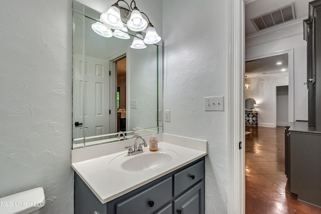 1025 Monet Cv, Brandon, MS 39047 - half bath with vanity, a textured wall, toilet, and tile patterned floors