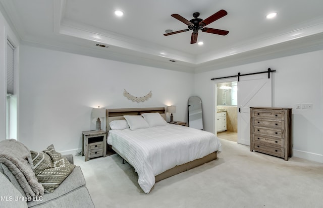 1025 Monet Cv, Brandon, MS 39047 - bedroom featuring a raised ceiling, a barn door, light carpet, recessed lighting, and crown molding