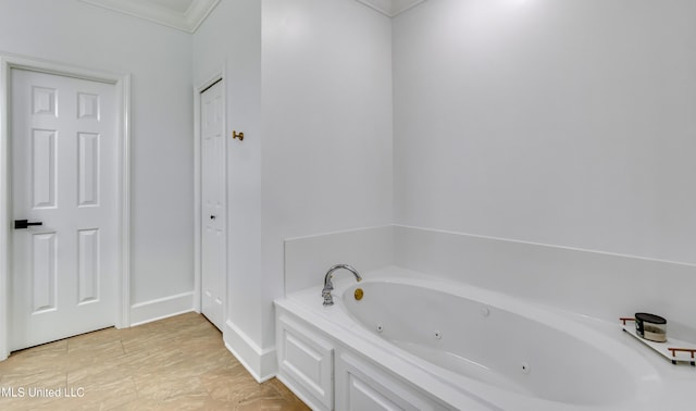1025 Monet Cv, Brandon, MS 39047 - full bathroom featuring a whirlpool tub, crown molding, and baseboards