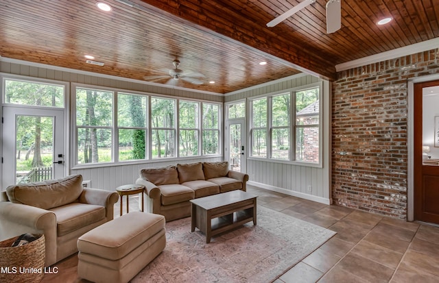 1025 Monet Cv, Brandon, MS 39047 - living room featuring a ceiling fan, wood ceiling, and brick wall