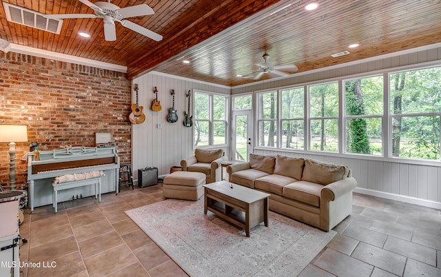 1025 Monet Cv, Brandon, MS 39047 - living room featuring a ceiling fan, wood ceiling, wooden walls, and baseboards