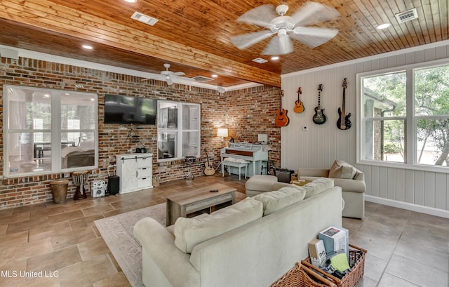 1025 Monet Cv, Brandon, MS 39047 - living room featuring a ceiling fan, wood ceiling, brick wall, recessed lighting, and baseboards