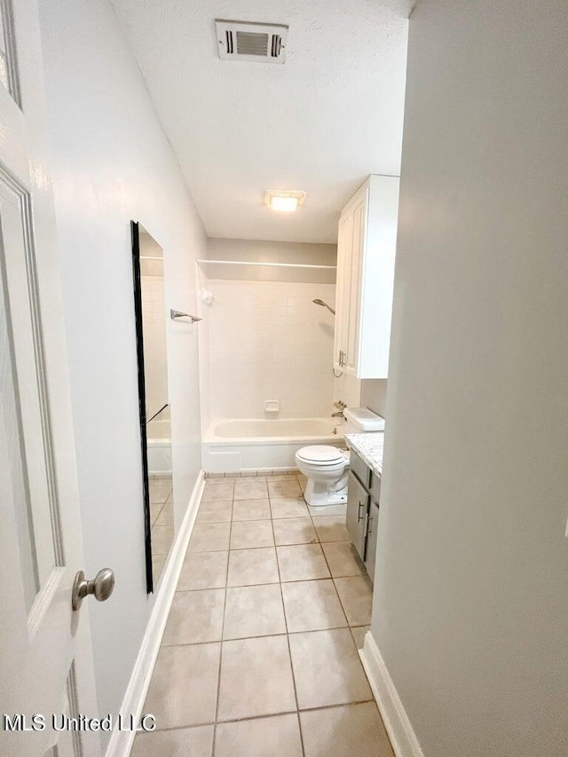 bathroom featuring tile patterned flooring, toilet, shower / bathtub combination, vanity, and baseboards