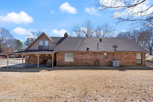 rear view of house featuring a patio area and cooling unit