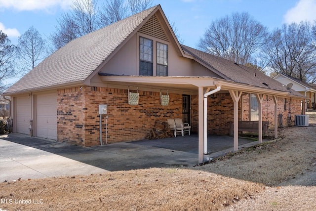 view of side of home featuring central AC