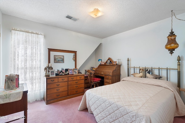 carpeted bedroom with a textured ceiling