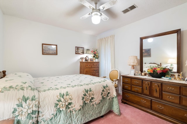 bedroom with light carpet and ceiling fan