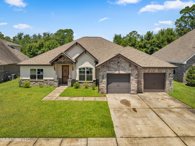709 Champagne Dr, Biloxi, MS 39532 - view of front facade featuring stone siding, stucco siding, an attached garage, a front lawn, and concrete driveway