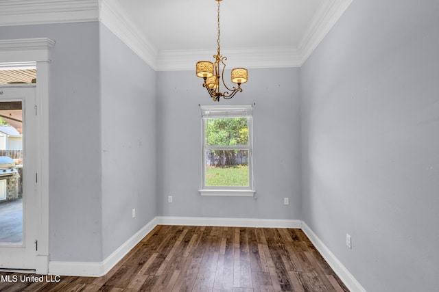 709 Champagne Dr, Biloxi, MS 39532 - unfurnished dining area with a chandelier, hardwood / wood-style flooring, and ornamental molding