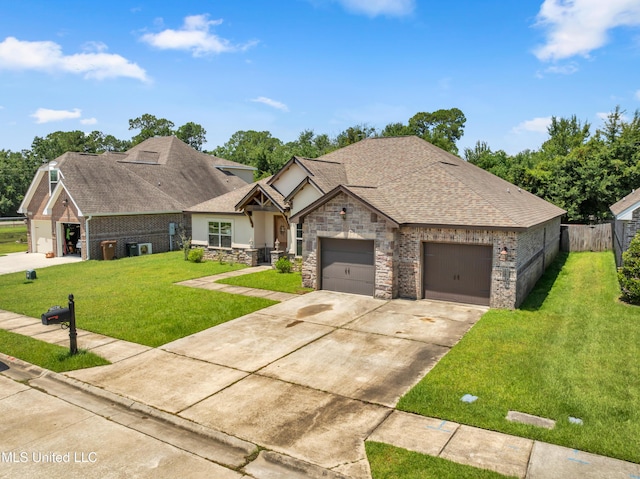 709 Champagne Dr, Biloxi, MS 39532 - view of front of home featuring driveway, stone siding, an attached garage, roof with shingles, and stucco siding