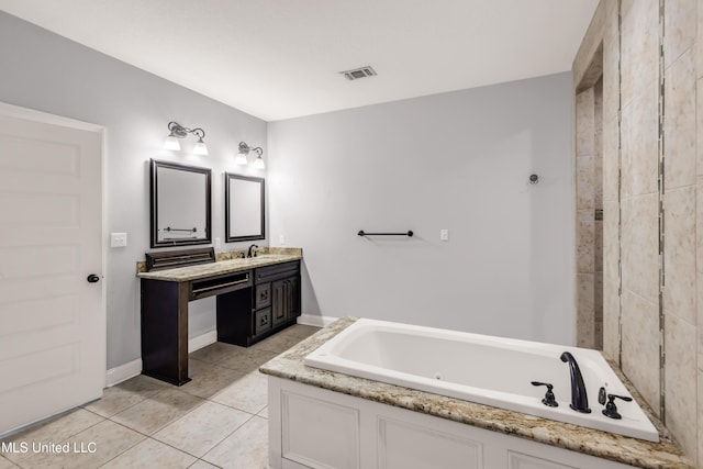 709 Champagne Dr, Biloxi, MS 39532 - bathroom with vanity, a jetted tub, and tile patterned floors