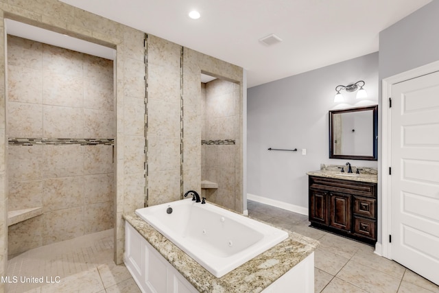 709 Champagne Dr, Biloxi, MS 39532 - full bath featuring a whirlpool tub, vanity, tile patterned flooring, walk in shower, and recessed lighting