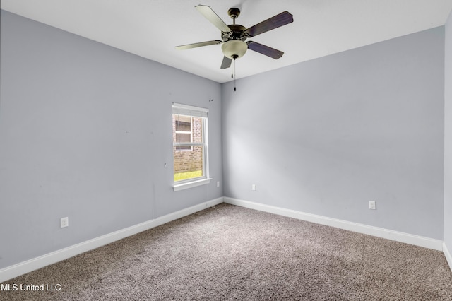 709 Champagne Dr, Biloxi, MS 39532 - carpeted spare room featuring baseboards and a ceiling fan