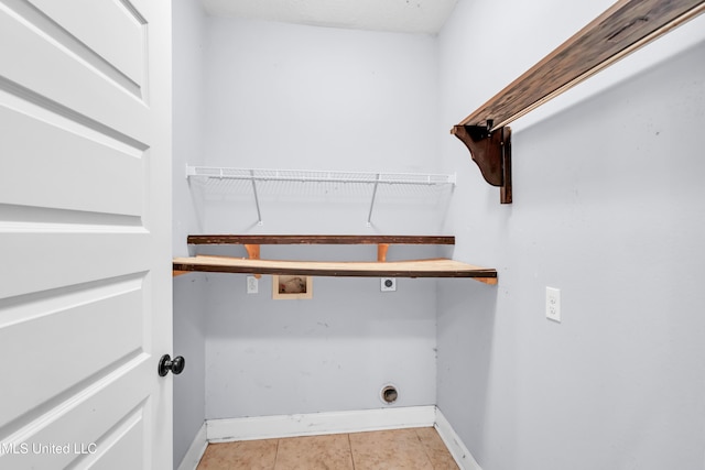 709 Champagne Dr, Biloxi, MS 39532 - washroom featuring electric dryer hookup, hookup for a washing machine, and tile patterned floors