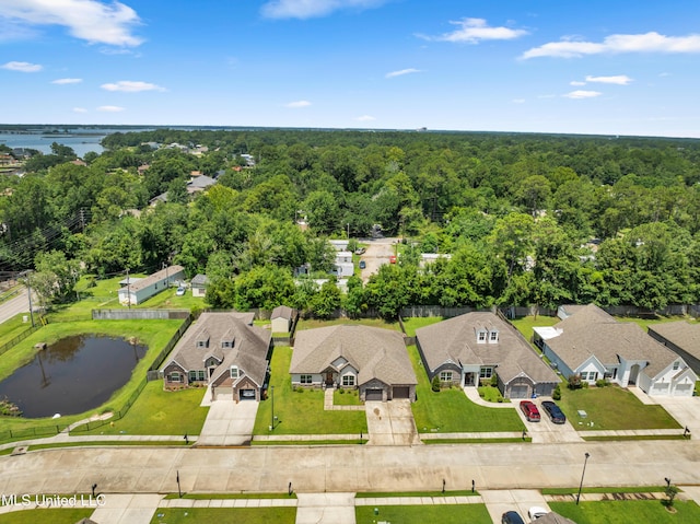 709 Champagne Dr, Biloxi, MS 39532 - aerial view of residential area featuring a heavily wooded area and a large body of water