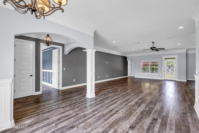 709 Champagne Dr, Biloxi, MS 39532 - unfurnished living room featuring a chandelier, ceiling fan, ornamental molding, wood finished floors, and arched walkways