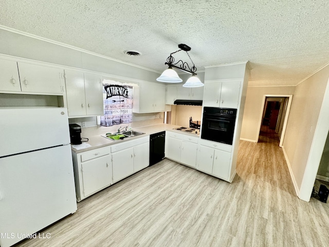 kitchen featuring light wood-style flooring, a sink, white cabinets, light countertops, and black appliances