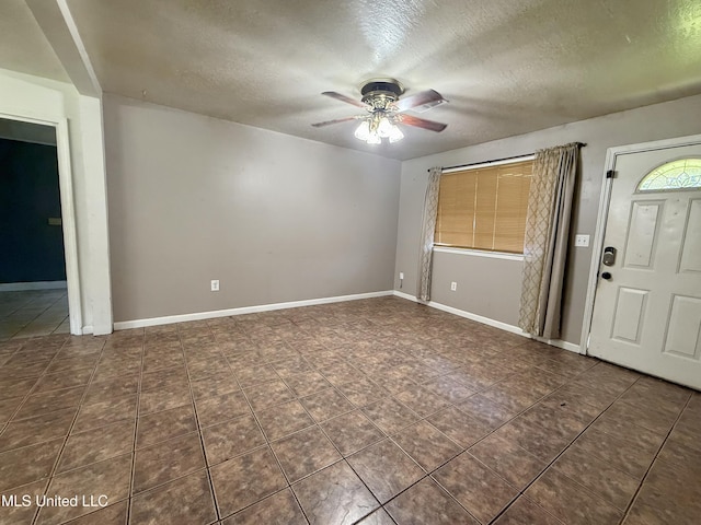 108 Mount Bass, Long Beach, MS 39560 - tiled foyer featuring ceiling fan, a textured ceiling, and baseboards
