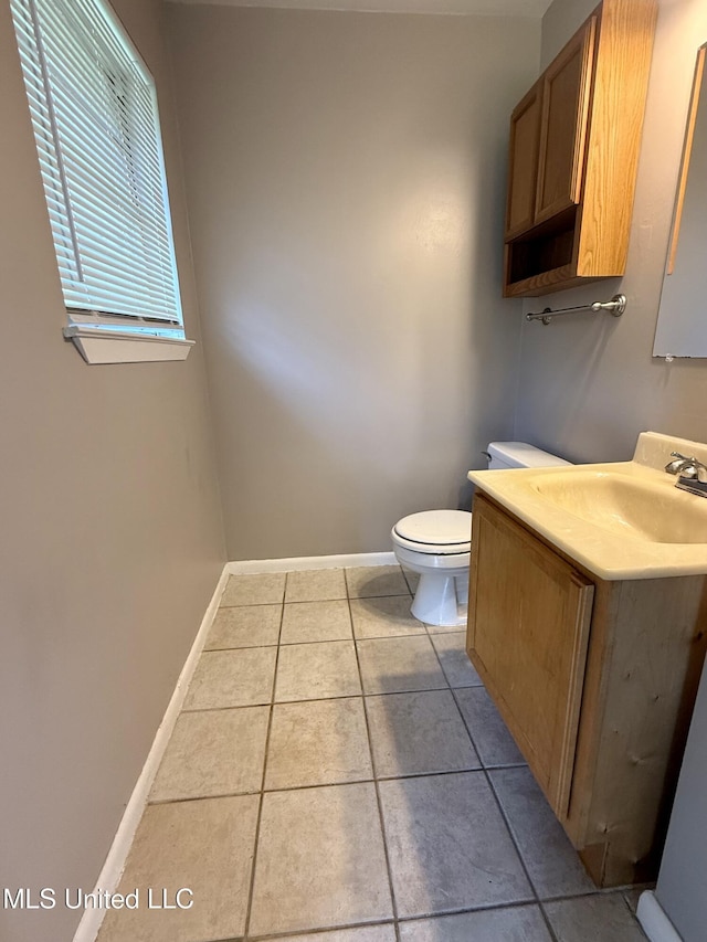 108 Mount Bass, Long Beach, MS 39560 - half bathroom with tile patterned flooring, vanity, toilet, and baseboards