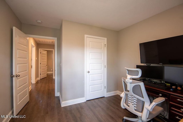 office featuring baseboards and dark wood finished floors