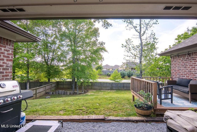 view of yard featuring a fenced backyard, visible vents, and an outdoor hangout area