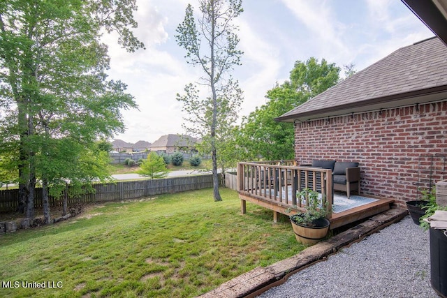 view of yard featuring a fenced backyard and a wooden deck