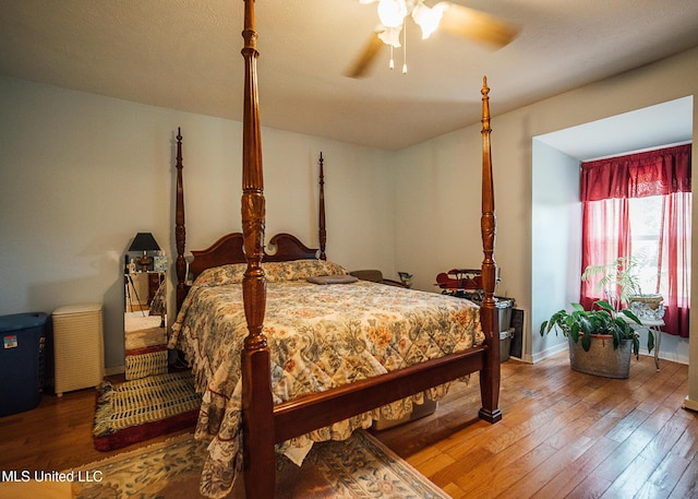 103 Hidden Lake Rd, Flora, MS 39071 - bedroom with wood-type flooring, baseboards, and ceiling fan