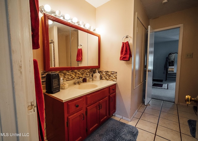 103 Hidden Lake Rd, Flora, MS 39071 - bathroom featuring vanity, tile patterned flooring, tasteful backsplash, and baseboards