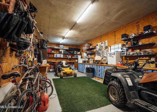 103 Hidden Lake Rd, Flora, MS 39071 - garage featuring a workshop area and wooden walls