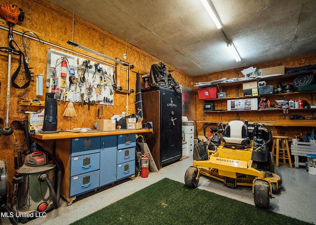 103 Hidden Lake Rd, Flora, MS 39071 - garage featuring a workshop area and wood walls