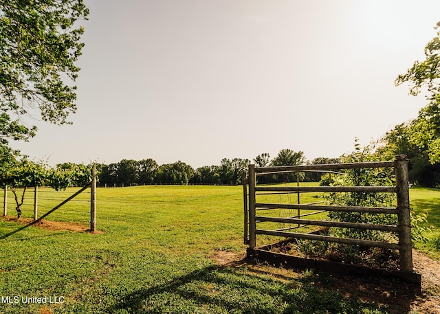 103 Hidden Lake Rd, Flora, MS 39071 - gate featuring a rural view and a lawn