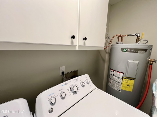 laundry area with water heater, cabinet space, and independent washer and dryer