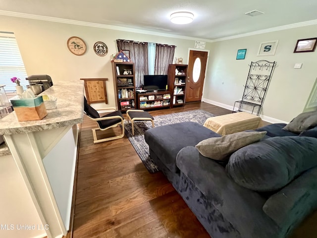 living area featuring crown molding, dark wood finished floors, healthy amount of natural light, and baseboards