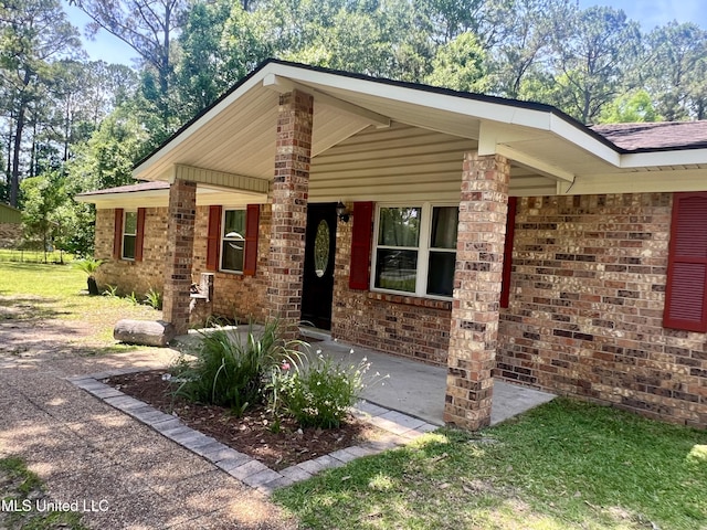 view of front of house featuring brick siding