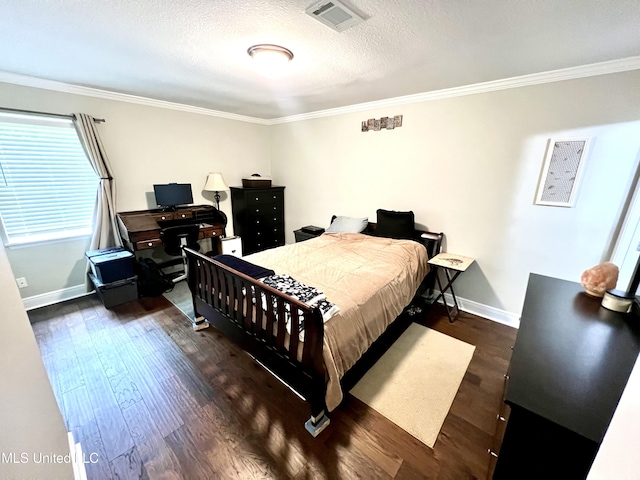 bedroom with wood finished floors, ornamental molding, baseboards, and a textured ceiling