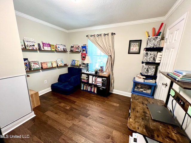 sitting room featuring wood finished floors, crown molding, and baseboards