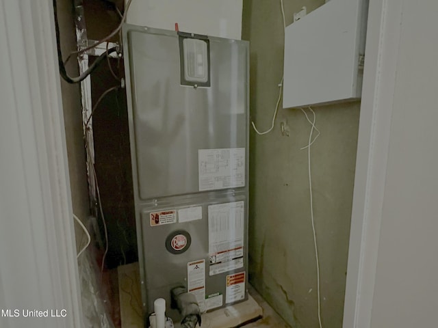 utility room featuring heating unit