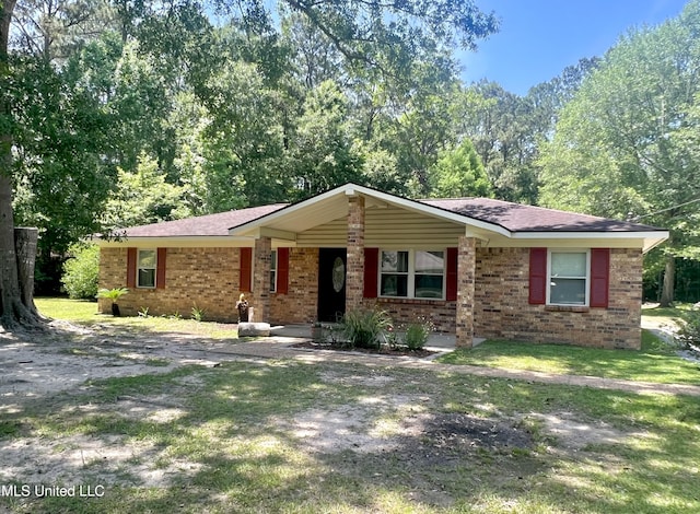 single story home with brick siding, roof with shingles, and a porch