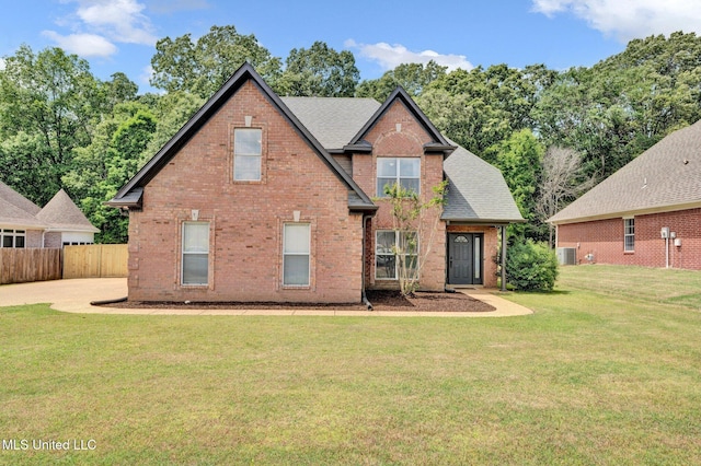 6177 W Sandbourne, Olive Branch, MS 38654 - back of house featuring a lawn, brick siding, fence, and a shingled roof