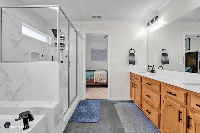 6177 W Sandbourne, Olive Branch, MS 38654 - ensuite bathroom with visible vents, connected bathroom, a tub, and a shower stall