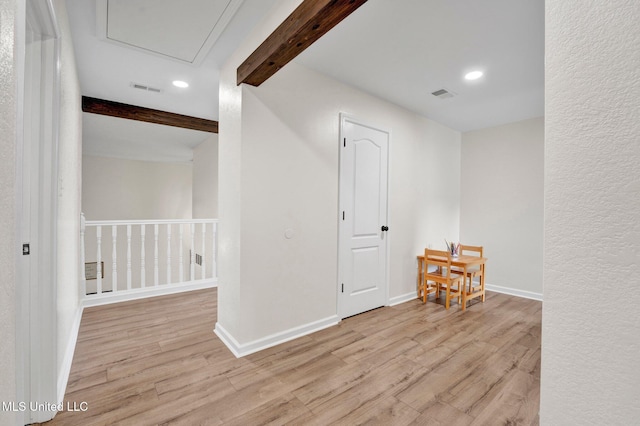 6177 W Sandbourne, Olive Branch, MS 38654 - empty room featuring beamed ceiling, visible vents, and wood finished floors