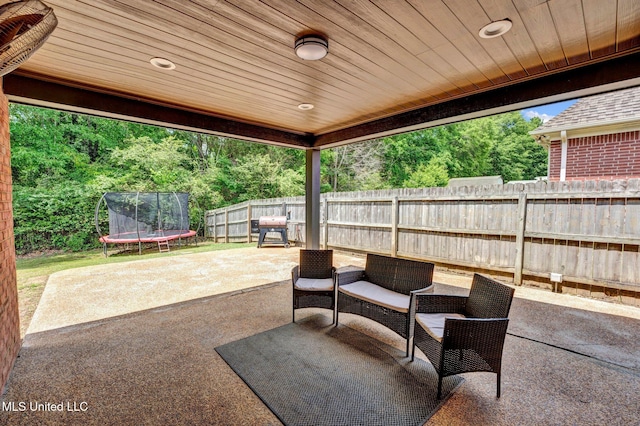 6177 W Sandbourne, Olive Branch, MS 38654 - view of patio featuring a fenced backyard and a trampoline
