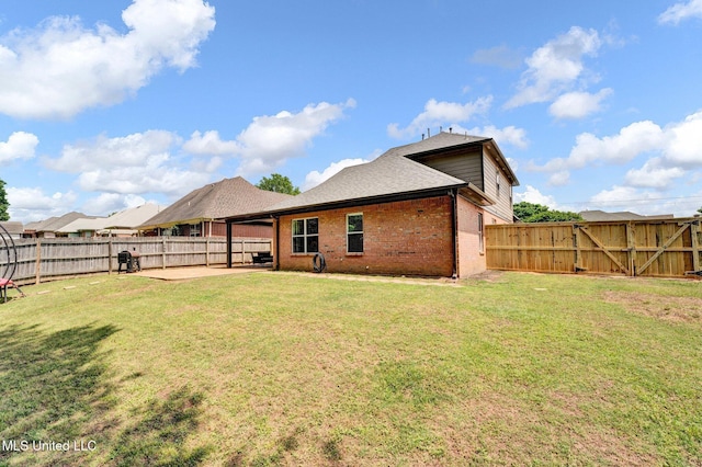 6177 W Sandbourne, Olive Branch, MS 38654 - rear view of house featuring a patio, a fenced backyard, a yard, and brick siding