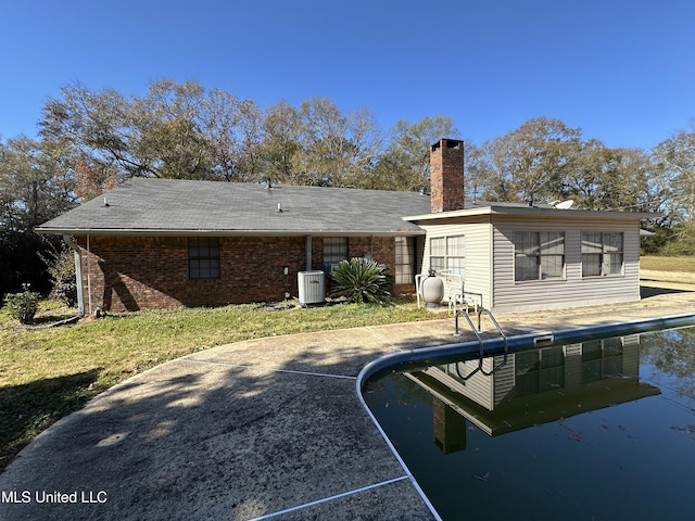 back of property featuring a patio and central AC unit