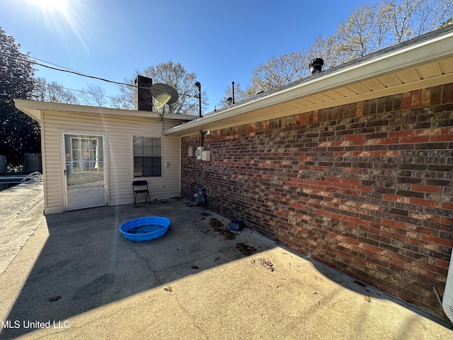 back of property featuring a patio