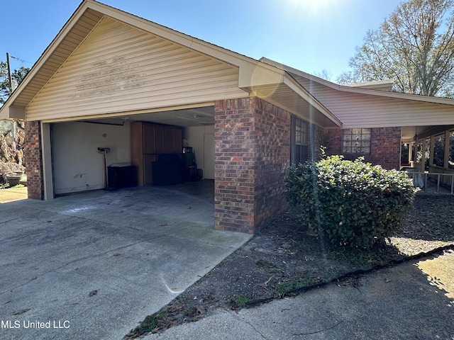 view of side of home with a carport