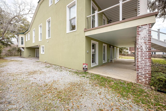 view of home's exterior featuring a patio area and stucco siding